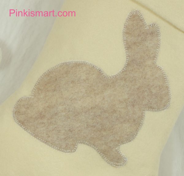 Rabbit Christmas Stocking Ivory with Beige Rabbit Applique Close-up Published